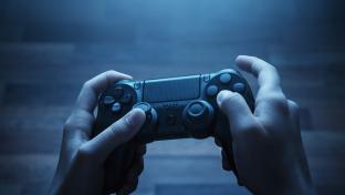 Close up of child hands playing the video game at night; Shutterstock ID 278969585