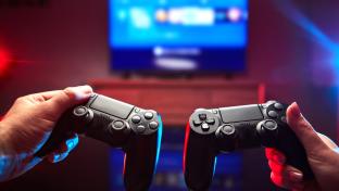 Gamer holding Gamepad, Controller or Videogame Joystick Console in hands. Close up, game concept; Shutterstock ID 1705733206